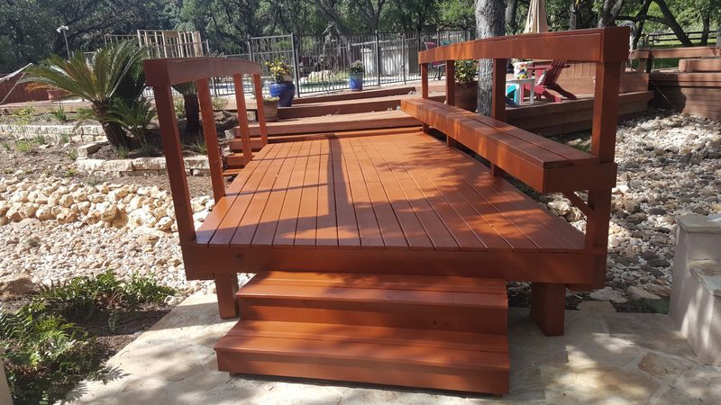 Stained deck with a built-in bench and steps